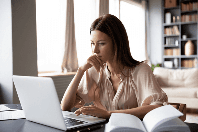 A girl staring at the laptop