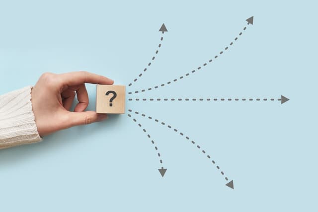 Arrows spreading from an wooden box with question mark on it