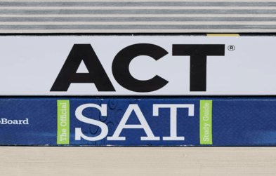 ACT book stacked on top of SAT book